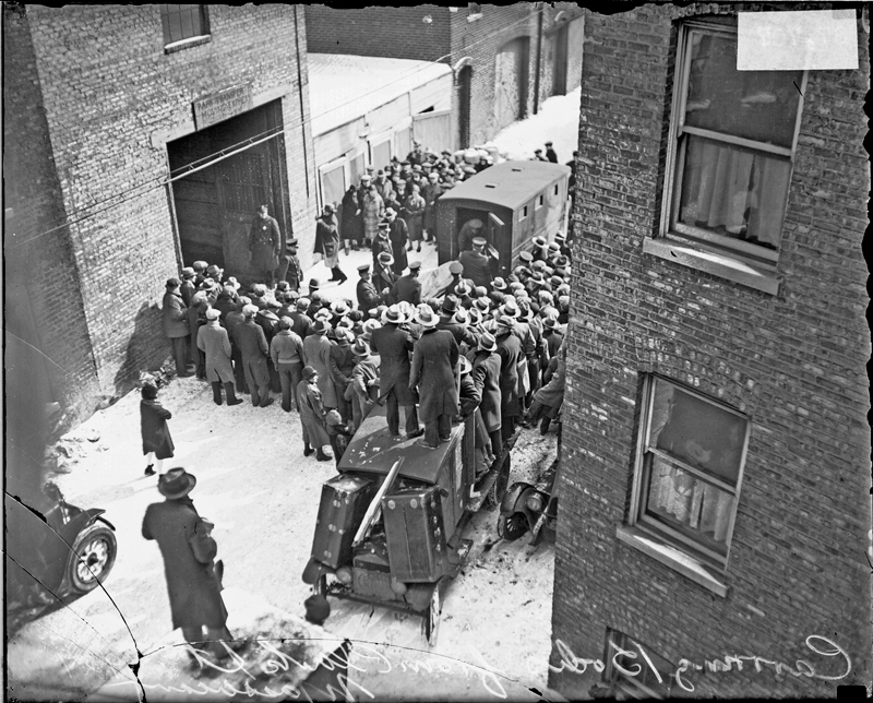 A crowd gathered at the site of the St. Valentines day massacre in Chicago ...