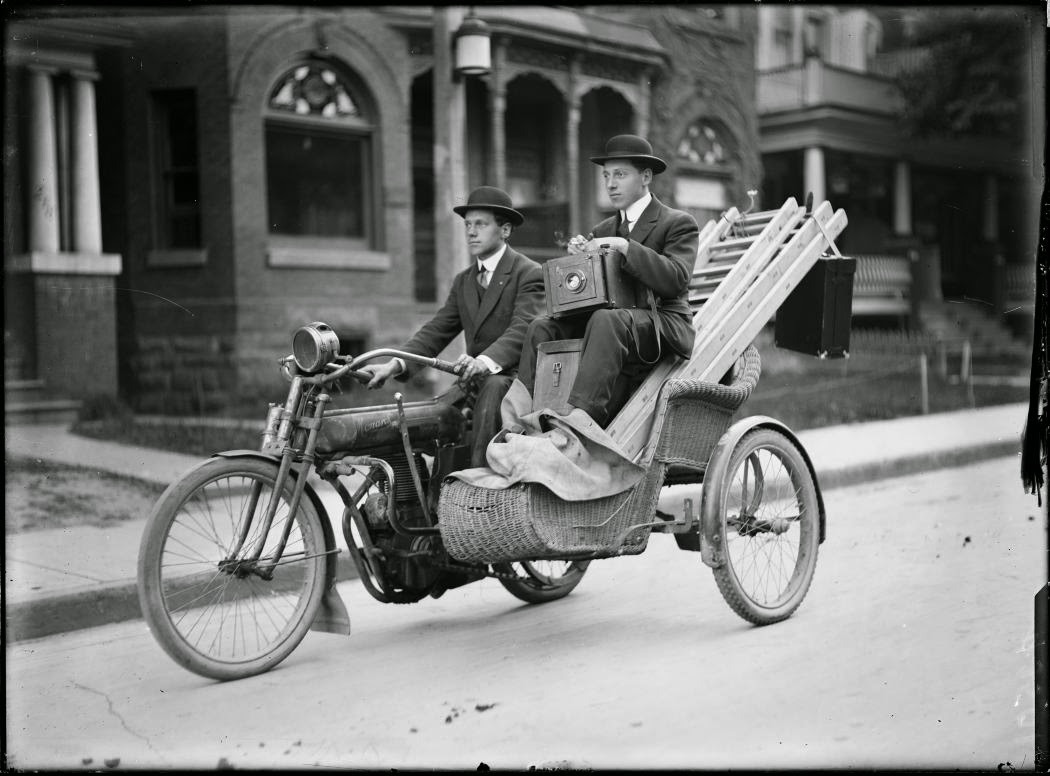 Photographers carry their equipment on a motorcycle in Toronto, 1912.jpg