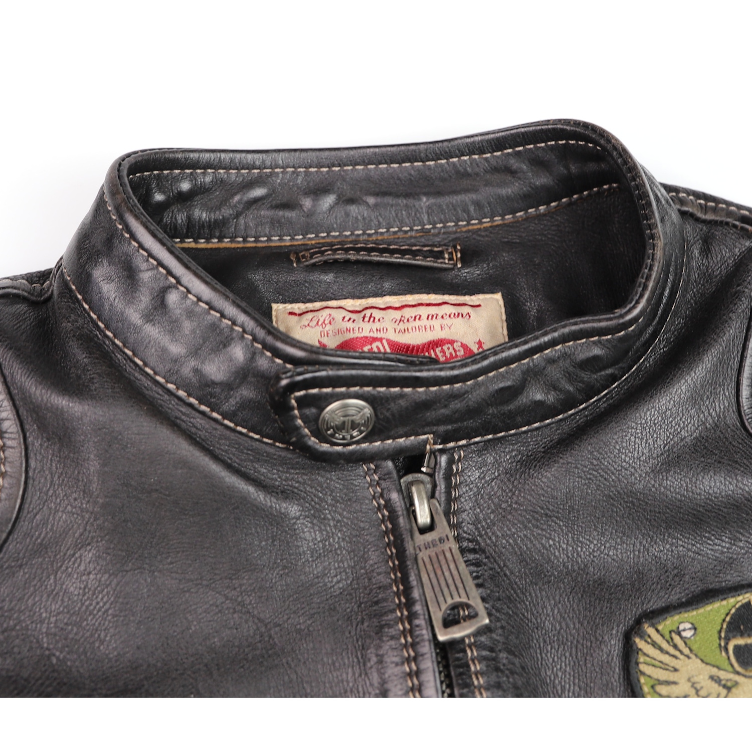 Thedi Cafe Racer with patches Black Teacore Bruciato Horsehide tag.jpg