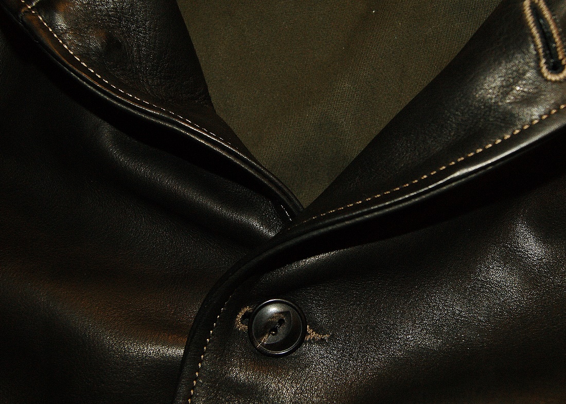 Thedi Shawl Collar Jacket Black Cowhide button close-up.jpg