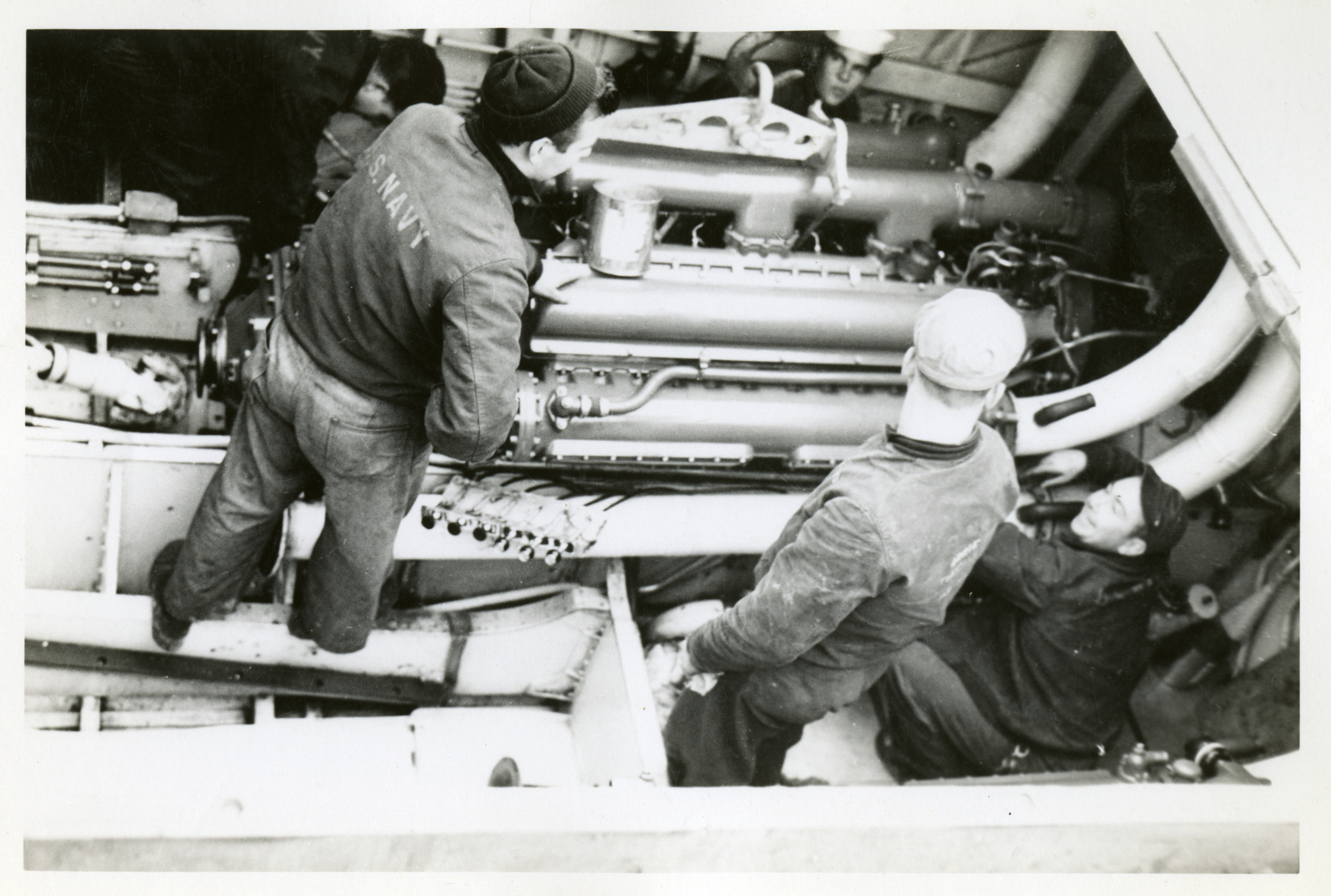US PT Boat Crewmen working on engine.jpg
