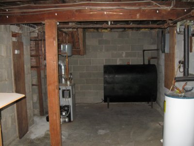 basement northeast side showing oil tank and furnace.JPG