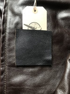 Blackened brown swatch on dark seal jacket.JPG